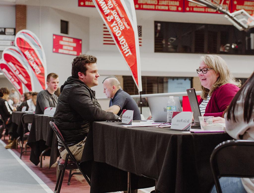 faculty advising a student during priority enrollment event